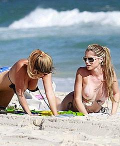 Brazilian models Fernanda Araldi and Larissa Gomes sunbathing topless in Barra da Tijuca