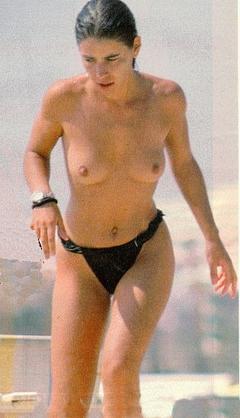 Italian singer Paola Turci topless on a beach paparazzi image