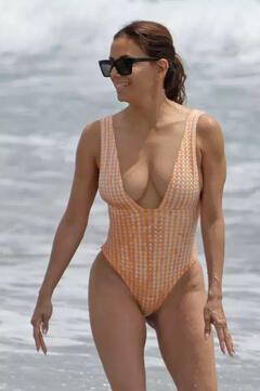 Eva Longoria cleavage in a swimsuit on the  beach in Marbella