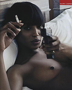 Black Naomi Campbell smoking topless