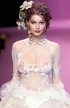 Laetitia Casta nude tits under see through dress runway image