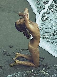 Marisa Papen fully naked on a beach