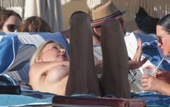 Lauren Foster sunbathing topless paparazzi photo