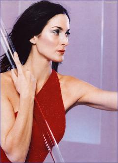 Carrie-Anne Moss in red dress