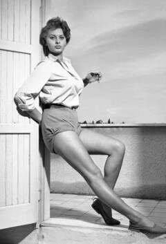Young Sophia Loren shows her long sexy legs