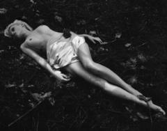 Anja Konstantinova lying naked in nature black-&-white photo