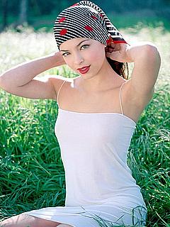 Kristin Kreuk in white tight dress in nature