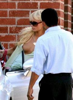 Paris Hilton flashing her nude tit paparazzi photo