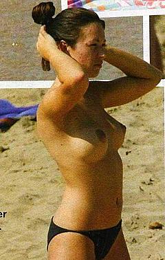 Natasha St-Pier topless on a beach paparazzi photo