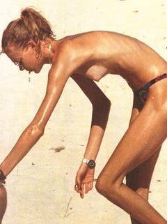 Jodie Kidd topless on a beach