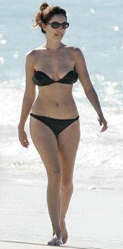 Kelly Brook in bikini on a beach
