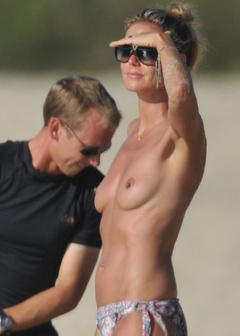 Heidi Klum nude tits on a beach