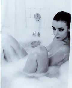 Elodie Bouchez naked in a bathtub