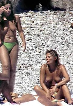 Patrizia Pellegrino topless on a beach with friends