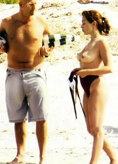 Italian actress Barbara D'Urso topless on a beach paparazzi photo