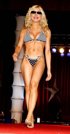 Blonde Courtney Peldon cleavage in bikini runway image