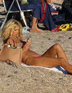Victoria Silvstedt sunbathing in a bikini at a beach in St Barth