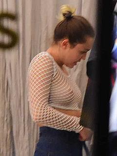Miley Cyrus nude tits under fisnet see through top when shopping in Soho
