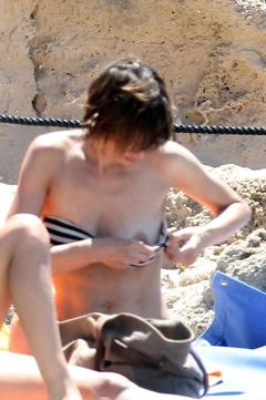 Italian actress Claudia Pandolfi tit slip on a beach paparazzi photo