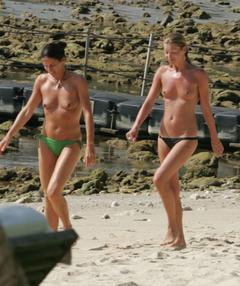 Kate Moss topless on a beacj with friends