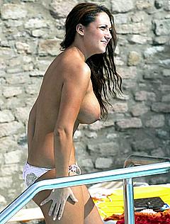 Busty Cassie Sumner topless poolside