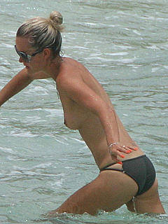 Laeticia Hallyday topless on the beach