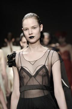 Finnish fashion model Suvi Koponen walks runway braless in see through dress