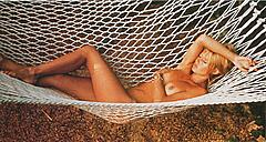 French actress Brigitte Bardot lying nude in hammock