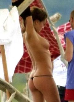 Alena Seredova topless changing on a beach