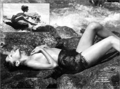 Russian actress Oksana Fandera lying topless cover her tits