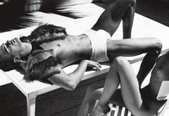 Bridget Malcolm lying topless