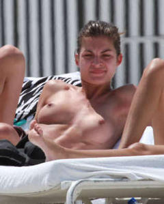 Yaya Kosikova tanning topless on a beach