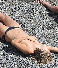 Sienna Miller sunbathing topless
