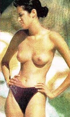 Brunette Yasmeen Ghauri sunbathing topless