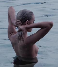 Elly Sharp topless in a water image