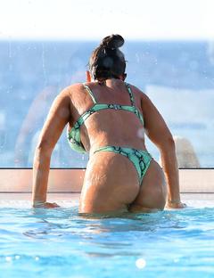 Megan Barton Hanson shows off her assets at the pool in Crete