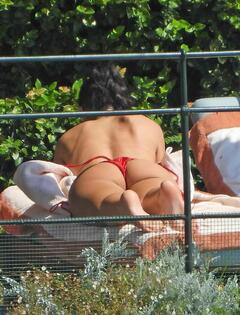 Dua Lipa sunbathing in red bikini in Portofino, Italy - August 15, 2026