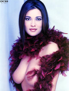 Italian actress and model Manuela Arcuri posing topless