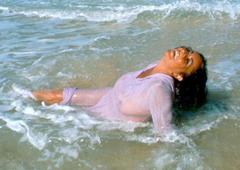 English-American actress Elizabeth Taylor in wet see through dress