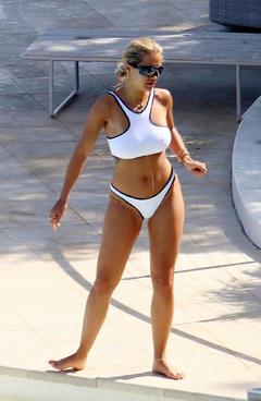 Rita Ora pokies in white bikini