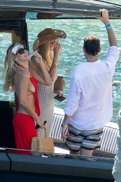 Brooks Nader sideboob in red dress at La Conca del Sogno - August 15, 2026