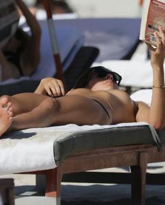 Lucy Aragon sunbathing topless