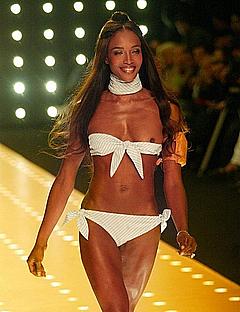 Naomi Campbell tit slip in white bikini runway photo