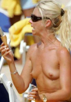 Tamara Beckwith topless on a beach with ice cream