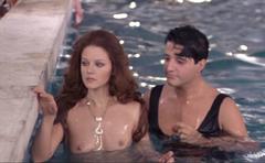 Italian actress Agostina Belli topless in a pool at Conviene far bene l'amore