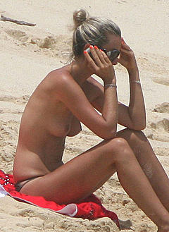 Laeticia Hallyday sunbathing topless