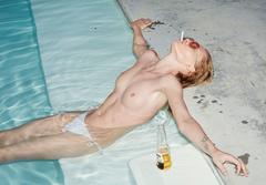 Kate Dyakonova smoking topless in a pool