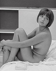 Macha Meril sitting nude on a bed scene from Une femme mariee
