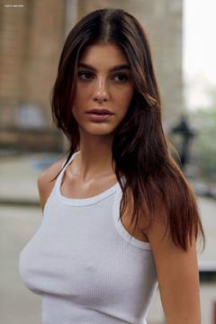 Camila Morrone braless in white top