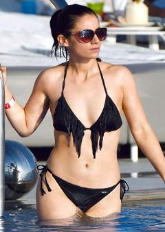 Frances Bishop in black bikini in a pool in Dubai